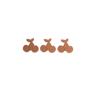 Three brown cherry-shaped icepacks on a white background