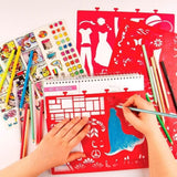 Child's hands sketching a blue dress design using a red stencil and colored pencils on a spiral-bound portfolio.