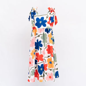 Colorful floral dress with blue, red, orange, and pink flowers on a white background