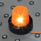 Close-up of a glowing orange LED light module with a black base, connected by blue and orange wires, on a grey circuit board.