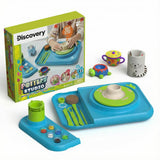 Discovery Kids motorized pottery wheel studio with blue base, green wheel, tools, paints, and three clay creations.