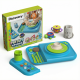 Discovery Kids Pottery Wheel Studio: blue motorized clay art station with green wheel, tools, paints, and finished clay crafts.