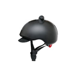 Doona Liki Helmet in matte black with unique silicon horns, adjustable chin strap, and red dial-fit system.