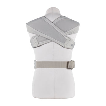 Ergobaby Embrace Heather Grey newborn carrier on a mannequin, showing the back with crisscross straps and waist belt.