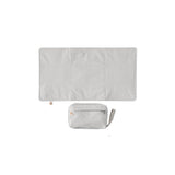Light gray Ergobaby portable changing pad, unfolded mat above a compact zippered diaper bag with wrist strap.
