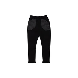 Black leggings with textured panels on a white background