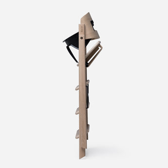 KAOS Klapp Kids Safety High Chair Rail in compact, natural wood with black accents.
