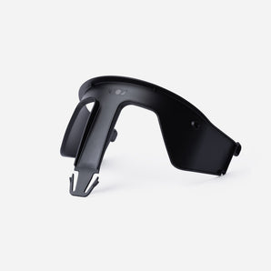 Black plastic Kaos Klapp high chair safety rail, compact and curved.