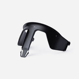 Black plastic Kaos Klapp high chair safety rail, compact and curved.
