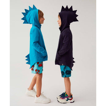 Two boys wearing Kuku Kid Dino Hoodie Cardigan Jackets: one in bright blue, the other in dark blue, both with spiked hoods and backs.