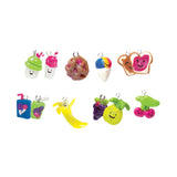 Colorful toy charms shaped like food items on a white background