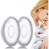 Two clear Medela breast shells with grey rims, shown next to a mother holding her baby.