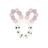 Pink, grey, and white silicone bunny ears teether with "MAITHI" spelled in black letters.