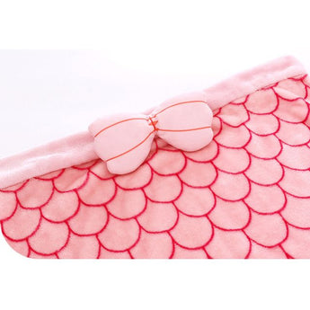 Soft pink mermaid sleeping sack with scale pattern and a cute bow detail.