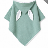 Organic green hooded baby towel with white bunny ears and trim.
