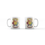 Two white 11 oz ceramic mugs with "Sassy Classy" text and a retro flower with a smiling face.