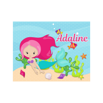 Personalized kids puzzle with a pink-haired mermaid, blue tail, seashells, fish, and "Adaline" text.