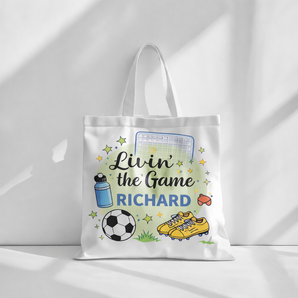 White cotton tote bag with "Livin' the Game RICHARD" text, soccer ball, cleats, water bottle, and goal design.
