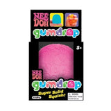 NEE DOH Gumdrop Squishy Fidget Toy Pink in packaging, showing its textured, super solid squish.