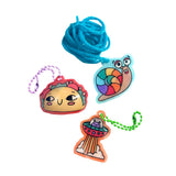 Ooly Shrink Its! DIY Shrink Art Bracelet Kit with colorful taco, snail, and UFO charms, plus blue string.