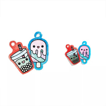 Two sets of Ooly Shrink Its! DIY shrink art charms: a large and small red boba tea, and a large and small blue ice cream.