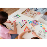 Kids coloring Ooly Shrink Its! DIY shrink art charms like tacos and ice cream with colorful markers.