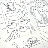 Ooly Undercover Art Rainforest Fun coloring pages with a bear fishing and manatees, featuring hidden patterns.