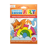 Ooly Undercover Art Smitten Kittens coloring set, 12 unique designs, featuring a sleeping orange cat on a rainbow.