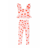 Pink children's outfit with red heart patterns on a white background