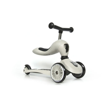 Light gray Scoot & Ride Highwaykick 1 2-in-1 ride-on scooter with black seat, handlebars, and wheels.