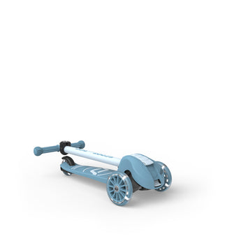 Light blue Scoot & Ride Highwaykick 3S LED 3-wheel scooter with glowing wheels, folded for storage.