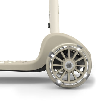 Beige Scoot & Ride Highwaykick 3S LED kids scooter with clear light-up front wheel.