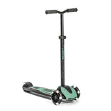 Black and mint green Scoot & Ride Highwaykick 5 LED kickboard scooter with glowing white wheels.