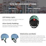 Green Scoot & Ride kids helmet with red LED light, soft padding, and magnetic fastener.