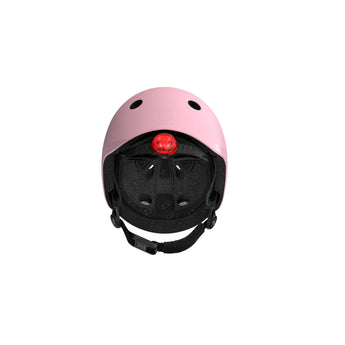 Pink Scoot & Ride kids helmet with a red LED light and black adjustable straps.