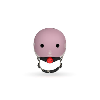 Pink Scoot & Ride kids helmet with a red LED light, magnetic fastener, and adjustable strap.