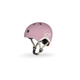Light pink Scoot & Ride kids helmet with white logo, adjustable straps, and black vents.