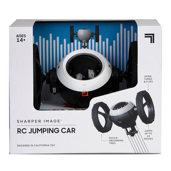 Sharper Image RC Jumping Car toy in white and black packaging, showing the futuristic car with large wheels.