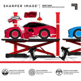 Red and blue Sharper Image RC demolition cars on lifts with controllers and pop-off body panels.