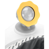 Close-up of Skip Hop Discoverosity activity center toy, a yellow sun-shaped light on a gray base.