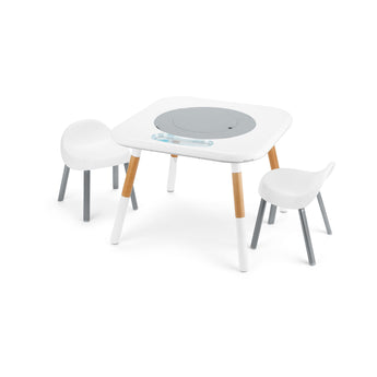White and wood modern children's activity table with two white chairs, featuring a gray circular insert.