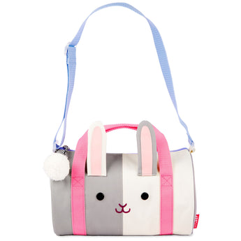 Skip Hop Duffimals kids' duffle bag, a gray and white bunny with pink ears and straps, blue shoulder strap, and white pom-pom.