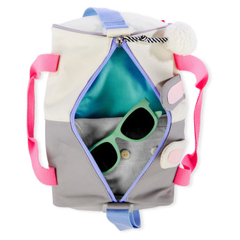 Skip Hop Duffimals kids' duffle bag, open, showing a gray and cream bag with pink handles, blue zipper, and green sunglasses inside.