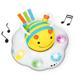 Yellow and blue striped Skip Hop Follow Bee crawl toy on a white cloud base with colorful lights and music notes.