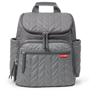 Skip Hop Forma grey quilted chevron backpack nappy bag with multiple zippered pockets and top handle.