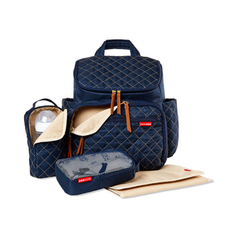 Navy quilted Skip Hop Forma backpack nappy bag with packing cubes, bottle holder, and changing pad.