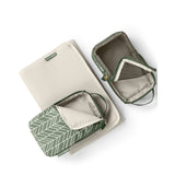 Skip Hop Forma nappy bag accessories: beige changing pad, green chevron and mesh packing cubes.