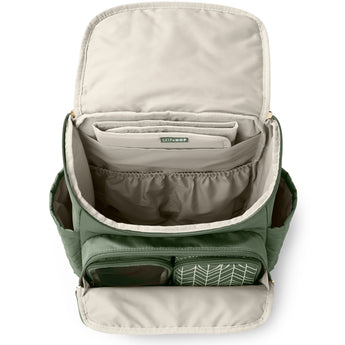 Open Skip Hop Forma quilted green diaper backpack with packing cubes, showing spacious interior.