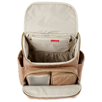 Open Skip Hop Forma quilted blush pink diaper backpack with organized interior and packing cubes.