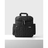 Black quilted Skip Hop Forma nappy bag backpack with multiple zippered pockets and top handle.